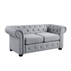 Causeuse Chesterfield capitonnée