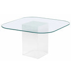 Table de salle à manger avec plateau en verre transparent et pieds en forme de planche de surf