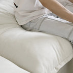 Canapé d'angle moderne et minimaliste avec rembourrage en duvet et housses de coussin amovibles